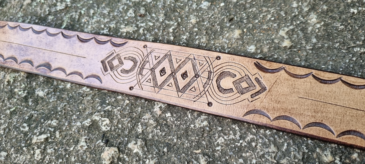 Stamped and carved leather belt