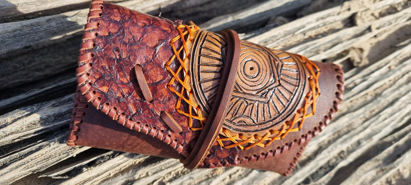 Carved tobacco pouch