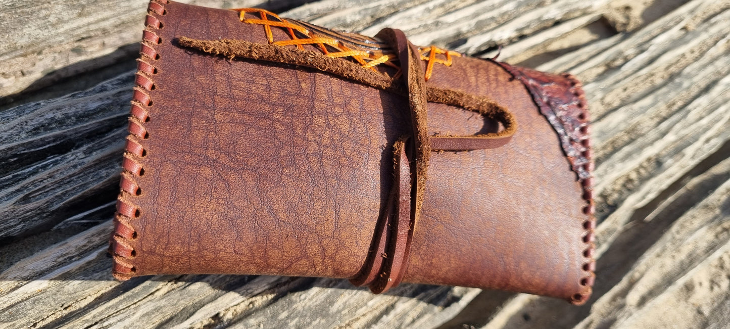 Carved tobacco pouch