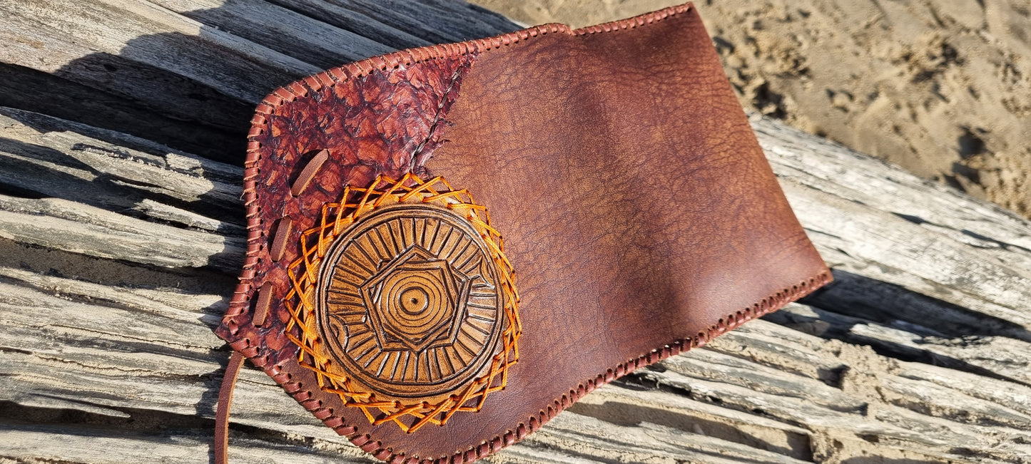 Carved tobacco pouch