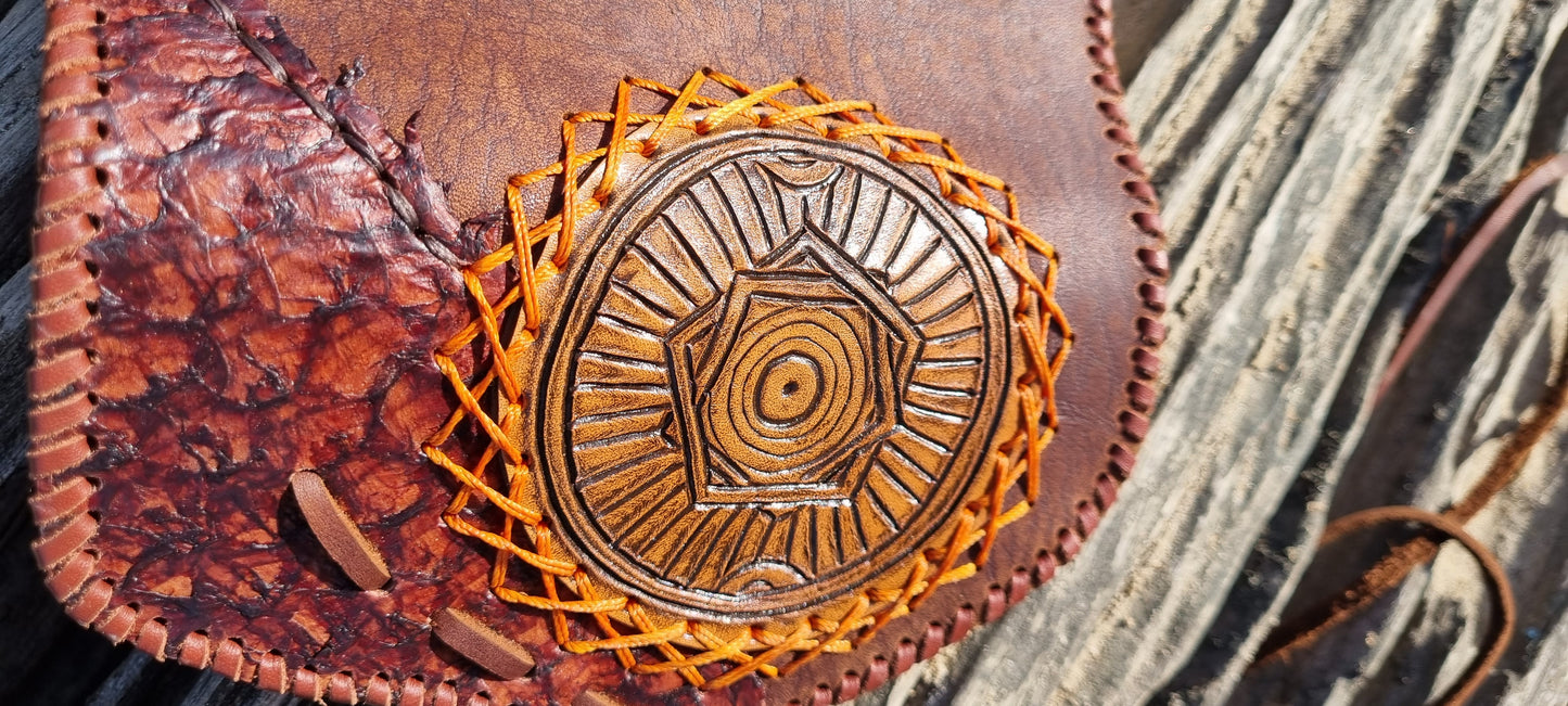 Carved tobacco pouch