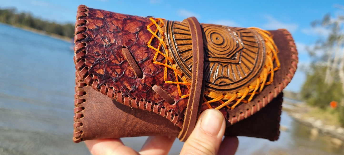 Carved tobacco pouch