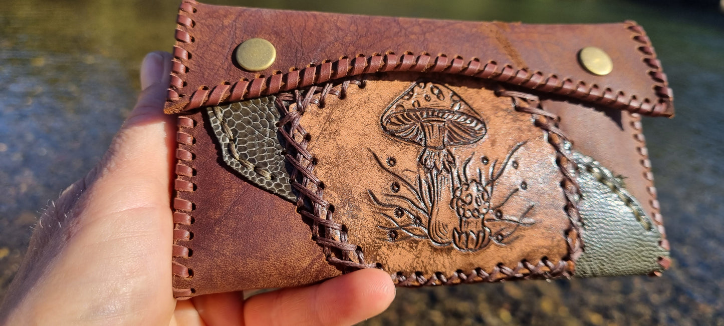 Carved tobacco pouch