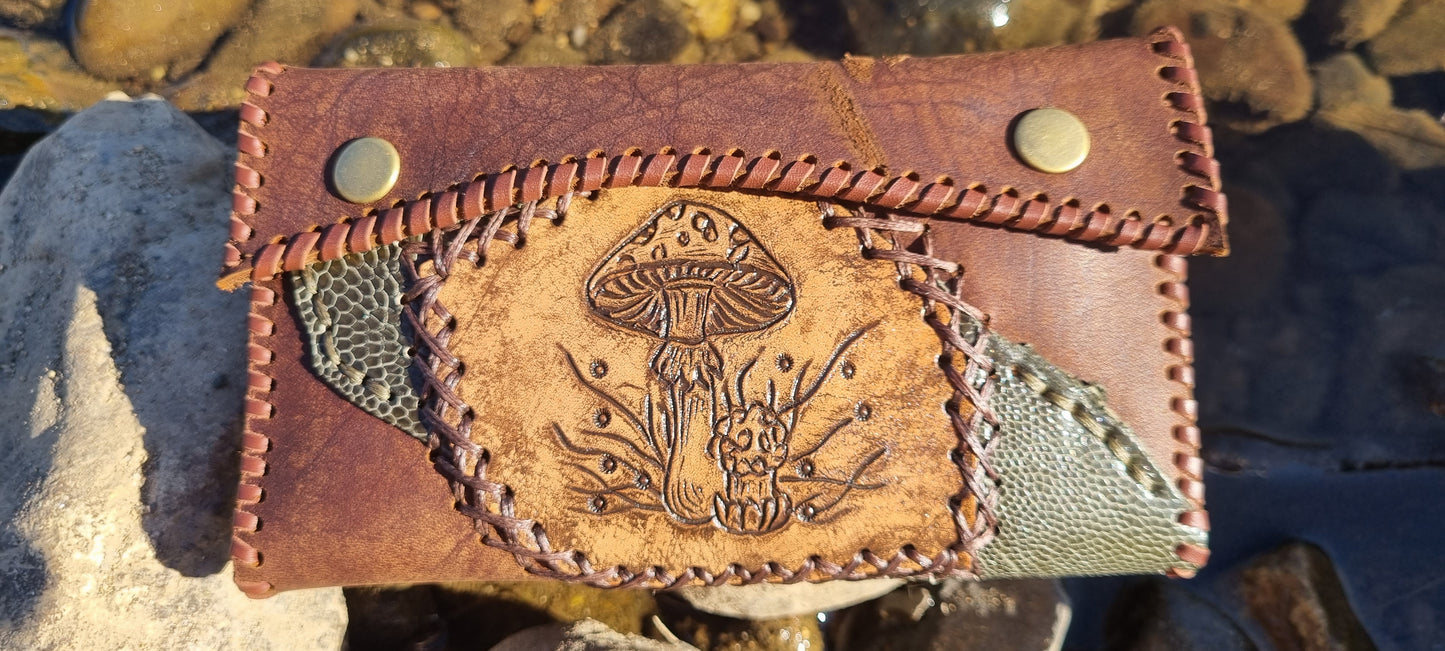 Carved tobacco pouch