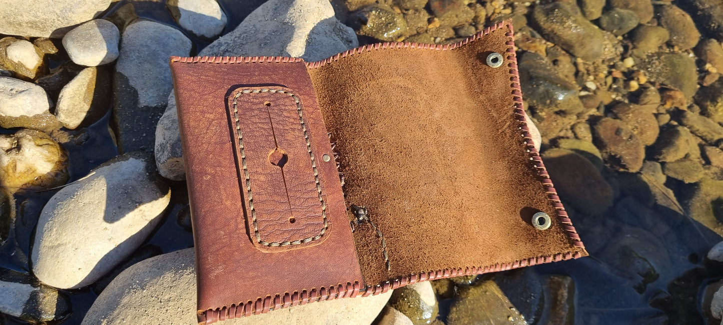 Carved tobacco pouch