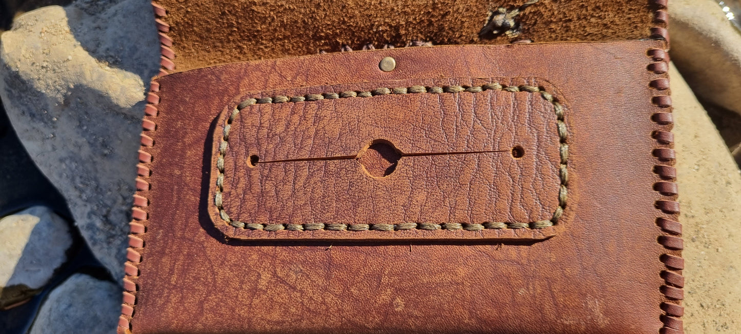 Carved tobacco pouch