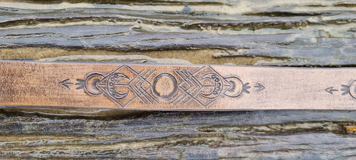 Carved leather belt