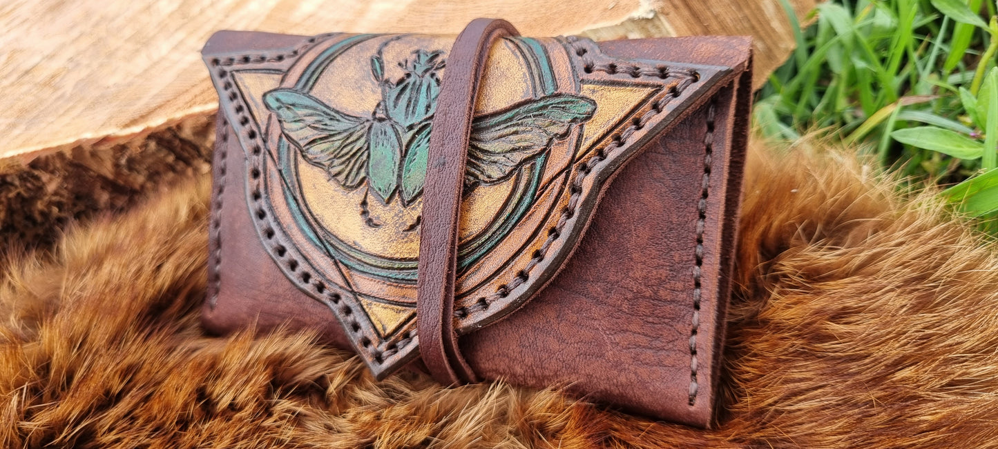 Carved scarob beetle tobacco pouch