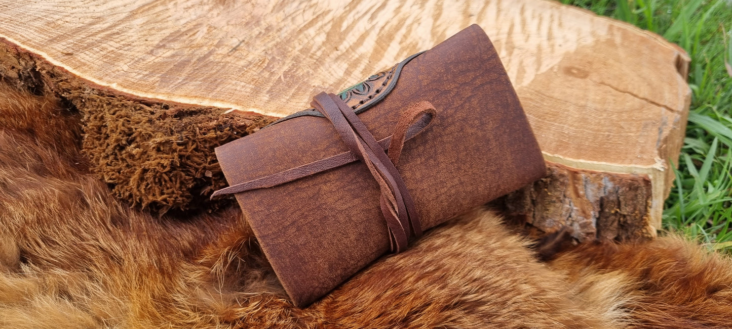 Carved tobacco pouch