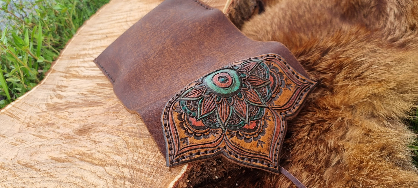 Carved tobacco pouch