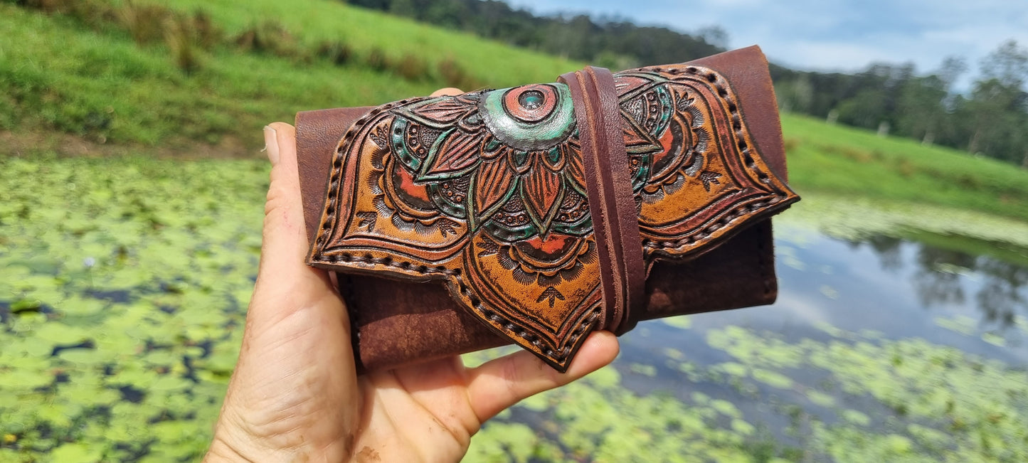 Carved tobacco pouch