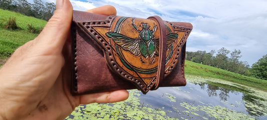 Carved scarob beetle tobacco pouch