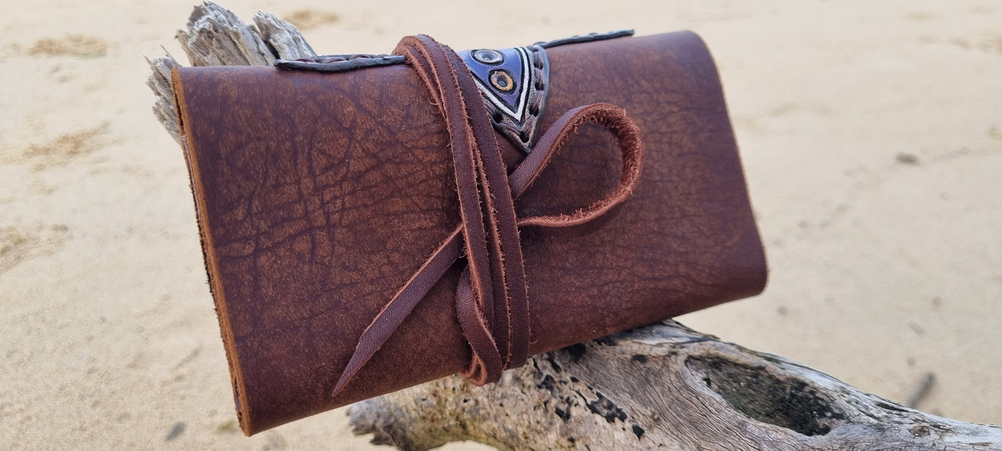 Carved tobacco pouch