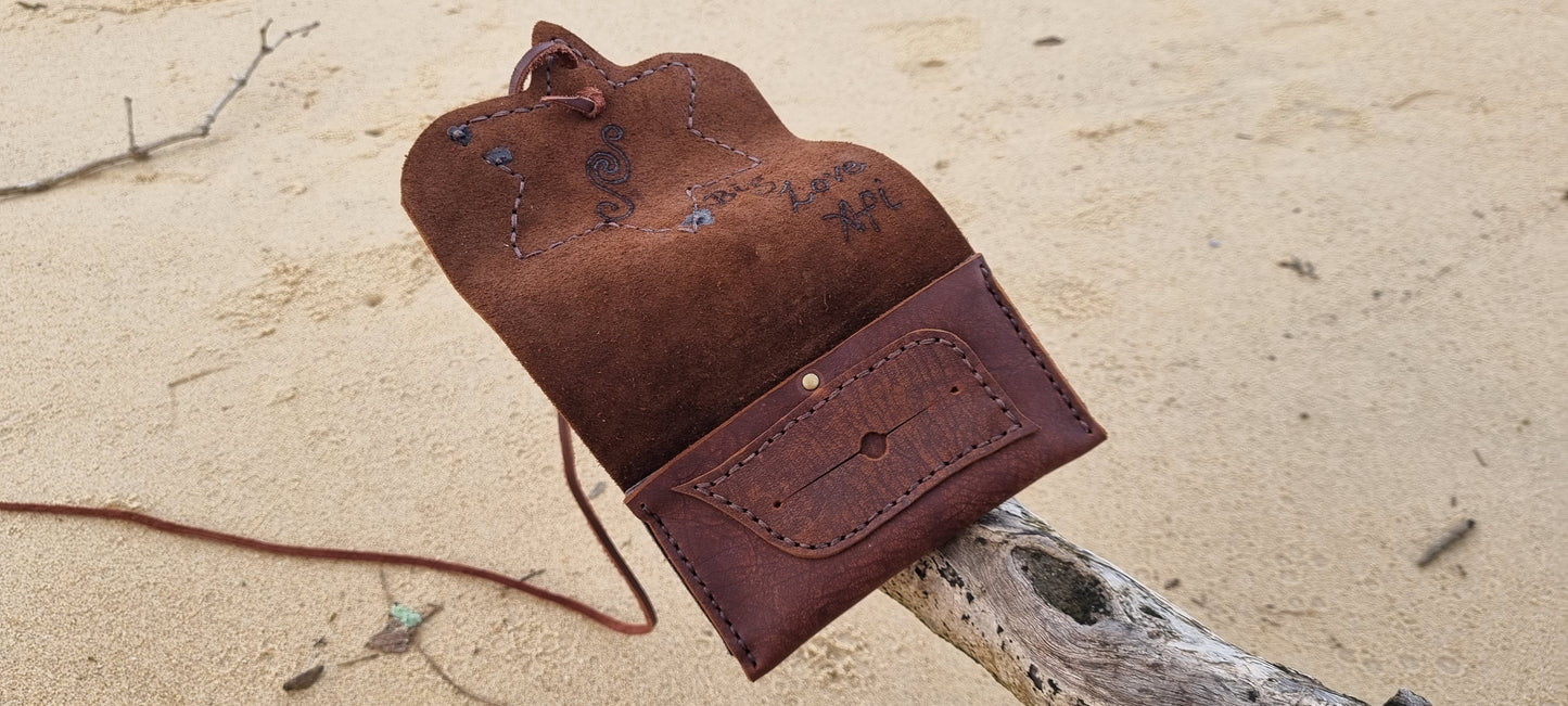 Carved tobacco pouch