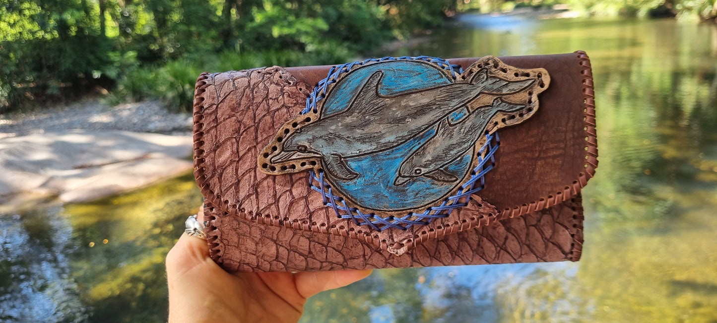 Carved dolphin purse