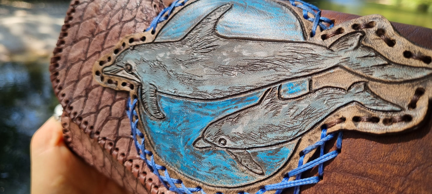 Carved dolphin purse