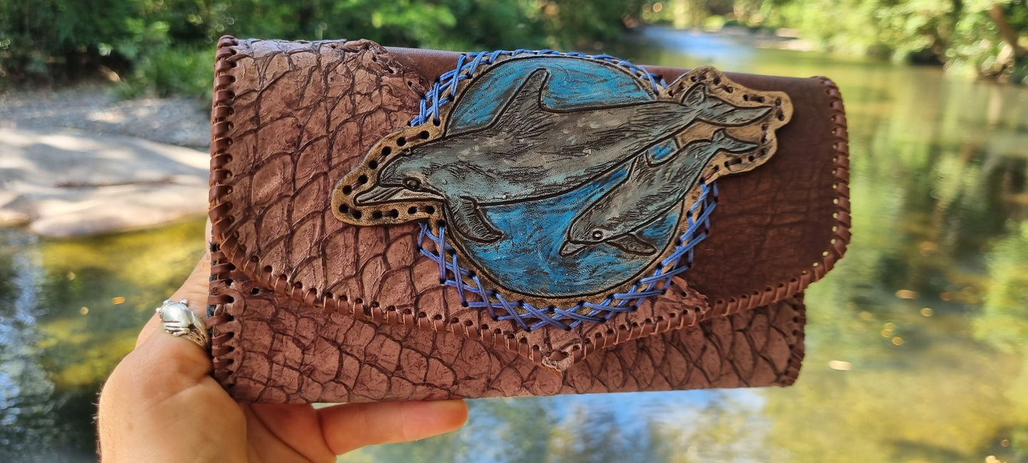 Carved dolphin purse