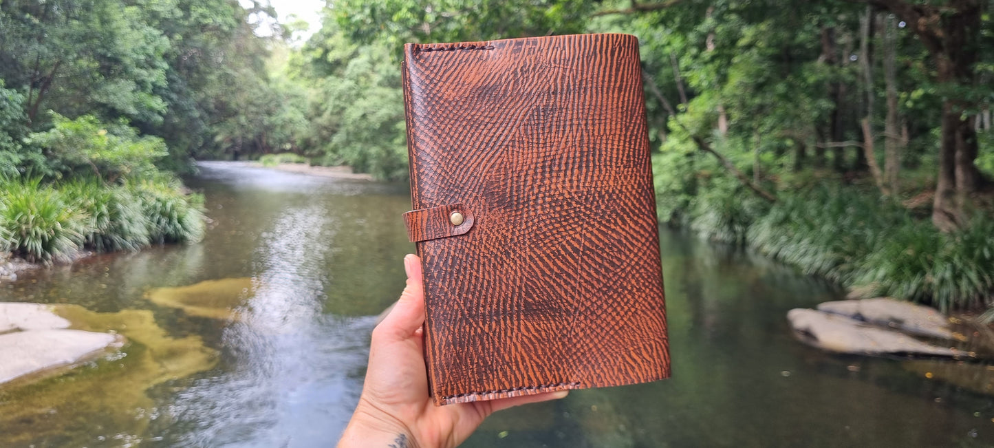 Carved journal cover with tigers eye