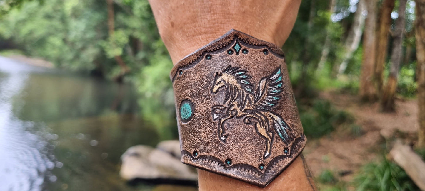 Caeved horse design leather cuff