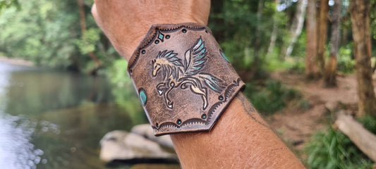 Caeved horse design leather cuff